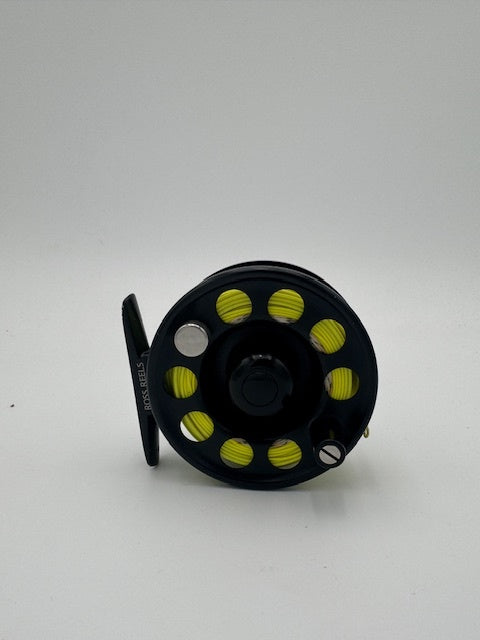 Ross Airus 1 fishing reel featuring a sleek black design with vibrant yellow accents, ideal for all anglers.