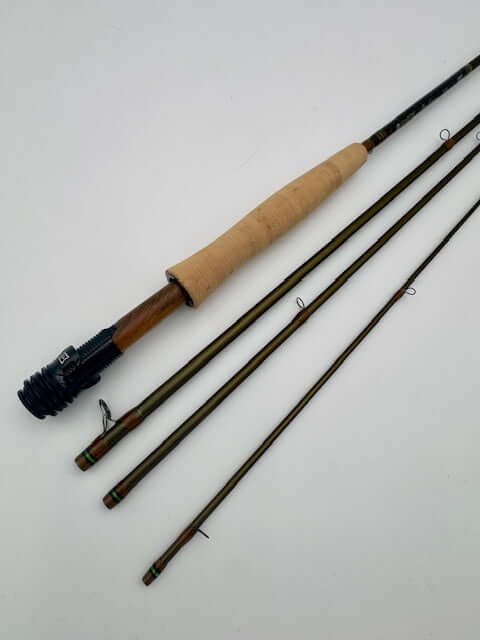 Hardy Ultralite LL 9'9" 4wt fly rod with wooden handle, ideal for smooth casting and freshwater fishing.