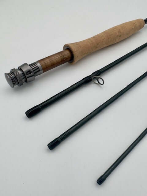 G.Loomis Asquith fishing rod with cork handle and three separate rod sections for optimal performance.
