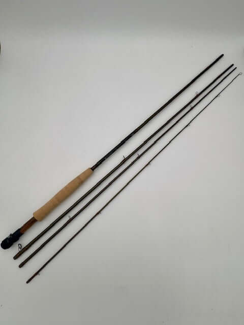 Hardy Ultralite LL 9'9" 4wt fly rod with wooden handle, shown in four sections, ideal for freshwater fishing.