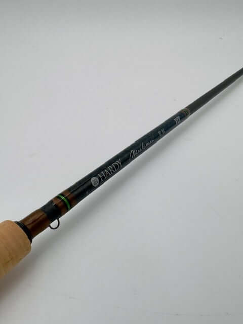 Hardy Ultralite LL 9'9" 4wt fly rod with black finish and wooden handle, designed for precision freshwater fishing.