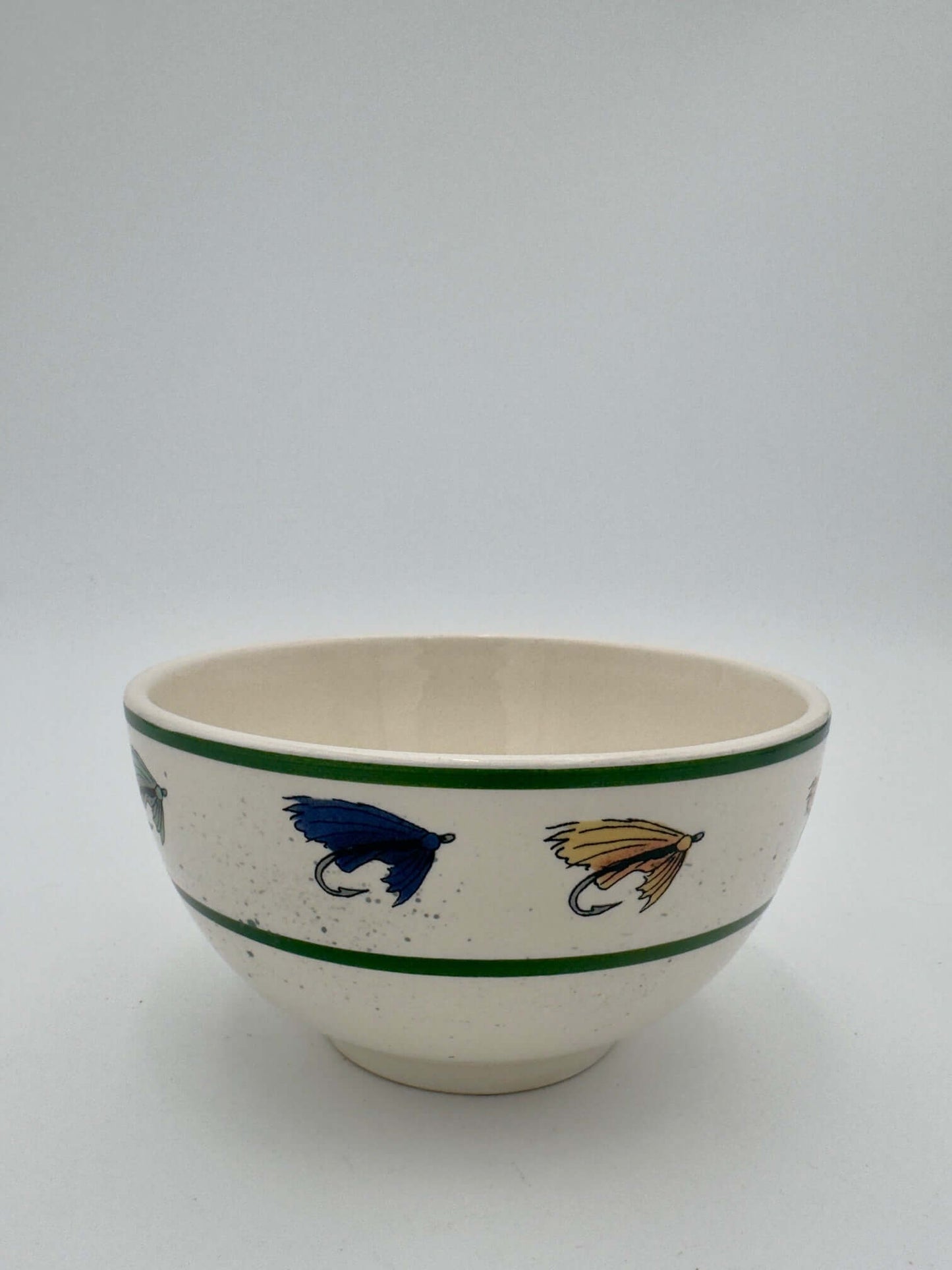 Lenox fishing bowl featuring vintage fly motifs in blue and yellow, perfect for rustic dining and fishing enthusiasts.