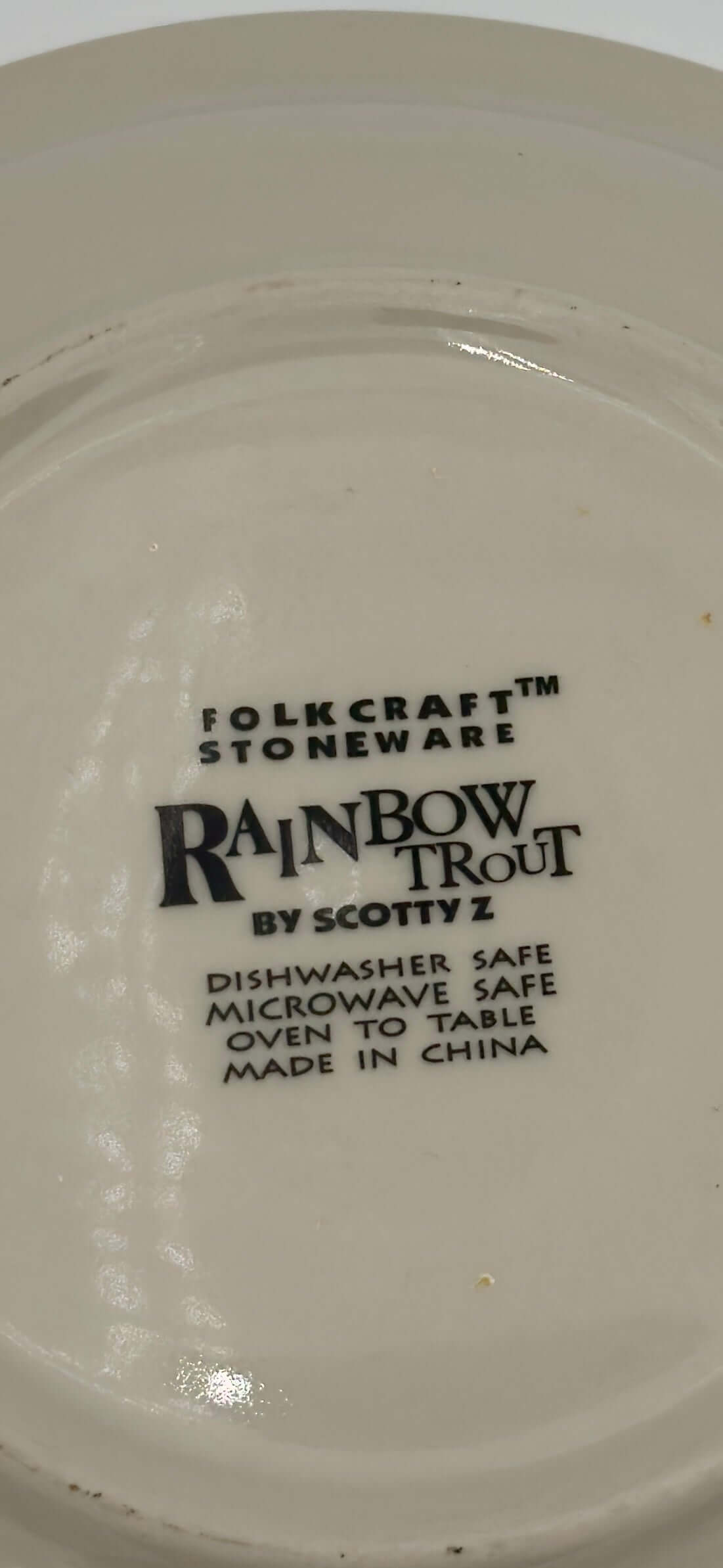 Folkcraft stoneware label featuring Rainbow Trout design, dishwasher and microwave safe, made in China.